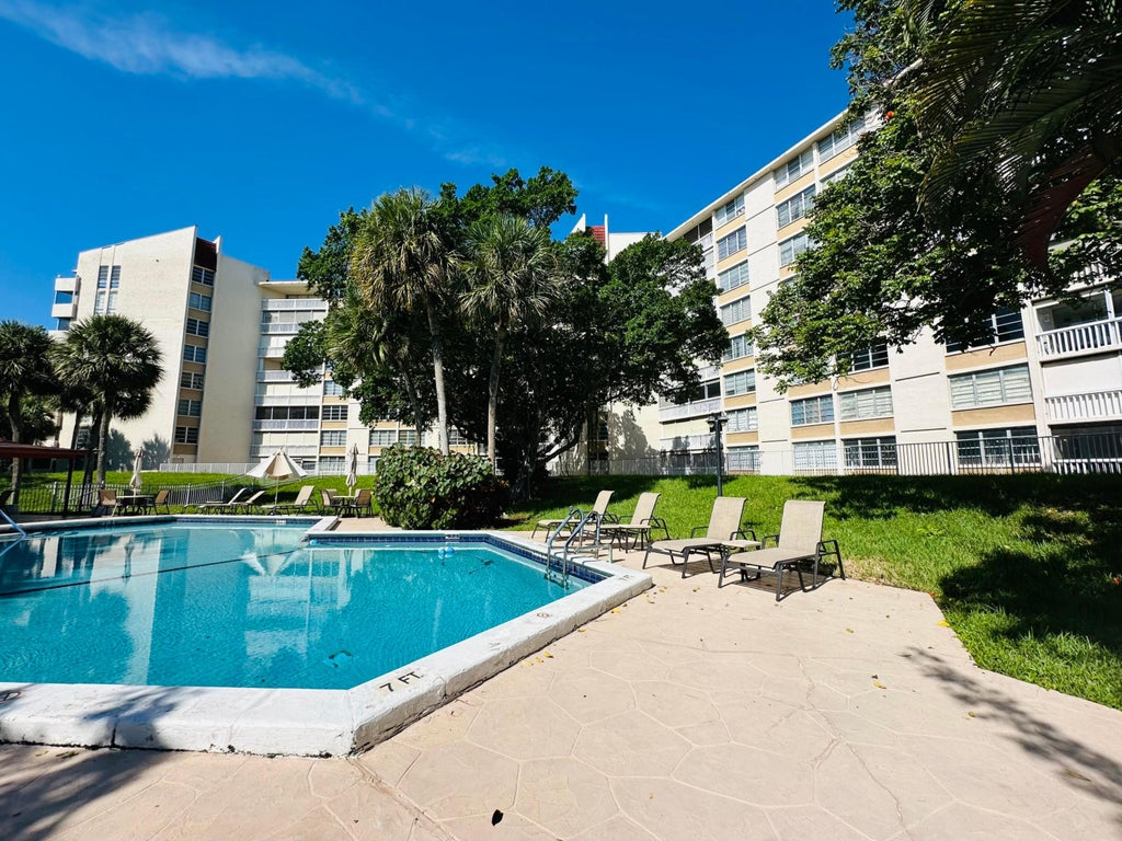 Photo of 6902 Environ Boulevard #1c, Lauderhill, FL 33319 (MLS # B26076529)