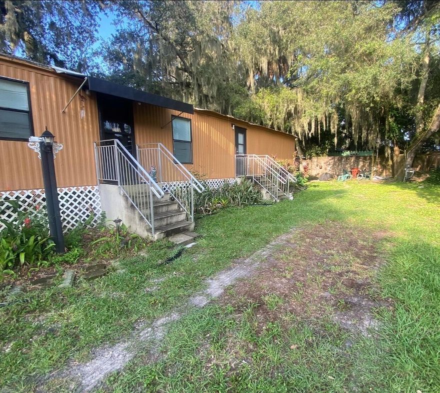 A LITTLE RETREAT RIGHT ON THE KISSIMMEE RIVER!   Step out of your front door and over to your private boat dock for a day on the Kissimmee River or Lake Okeechobee .     Two Bedrooms can accommodate a family or a group.   This property sits under a canopy of beautiful trees,  and there is a State Park Nearby for Hiking, Camping, and Nature Lovers.   A quiet and tranquil retreat.