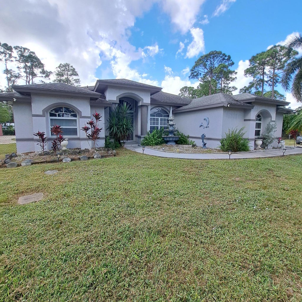 Photo of 13928 Citrus Grove Boulevard, West Palm Beach, FL 33412 (MLS # R11034480)