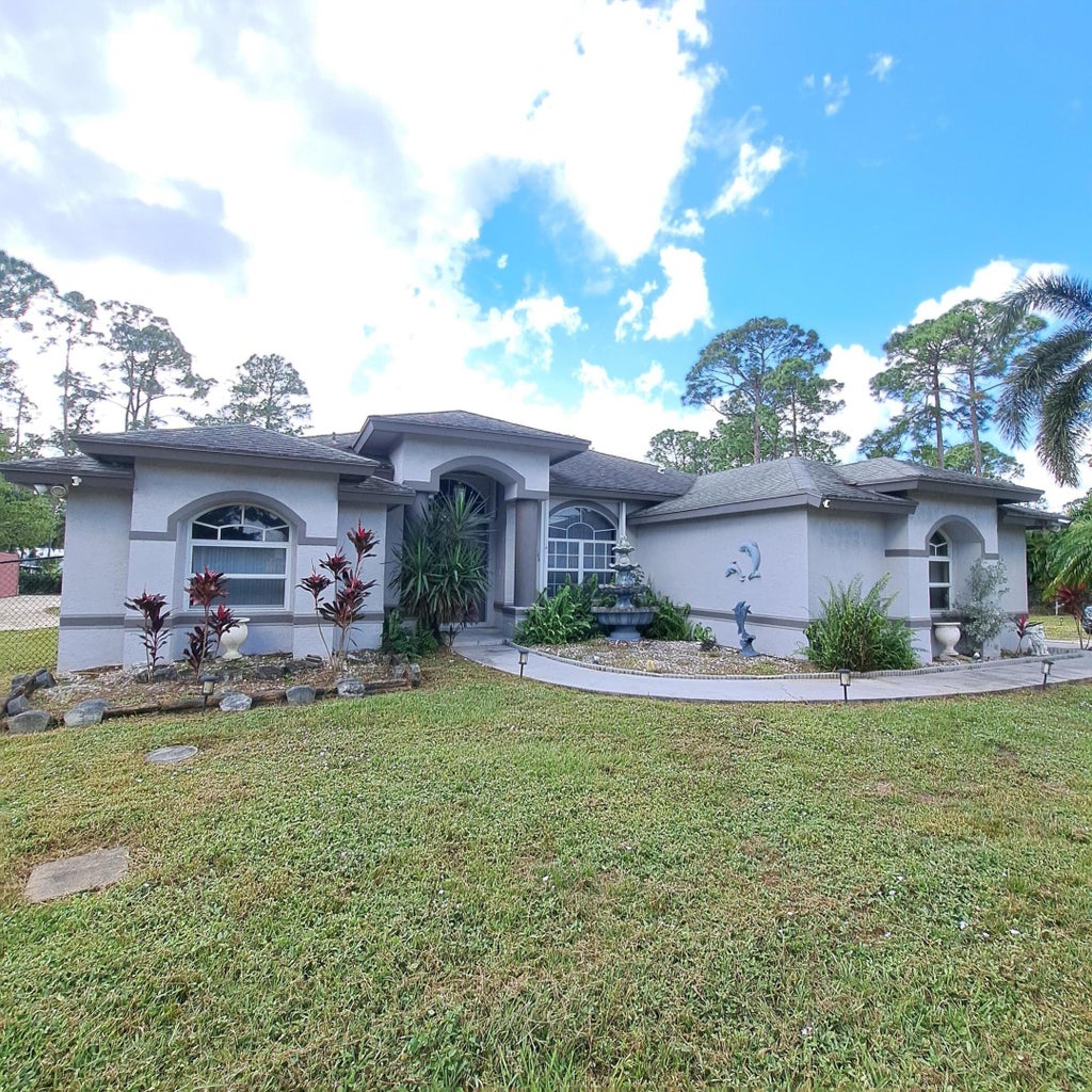 Photo of 13928 Citrus Grove Boulevard, West Palm Beach, FL 33412 (MLS # R11034480)