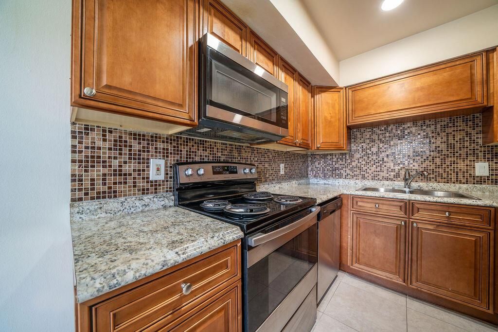 Photo of 227 Castlewood Drive #207, North Palm Beach, FL 33408 (MLS # R10743019)