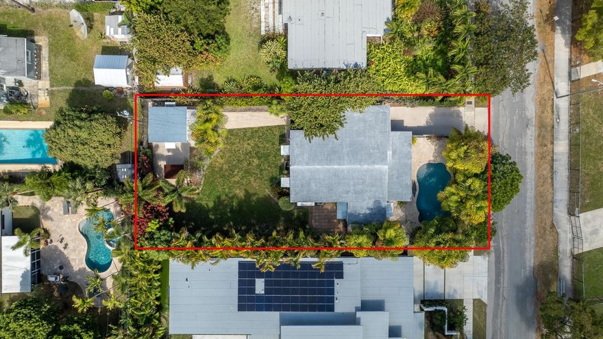 ***Air BnB + VRBO short term rental opportunity*** NO HOA!! Tremendous opportunity to develop & immediately turn into income producing property while you wait for approvals.  Build an ADU, build your dream home, remodel, or furnish for short term rentals; the possibilities are endless with this oversized 8111 sqft lot. Stunning resort style salt water pool surrounded by gorgeous travertine pavers & lush tropical landscaping. Outdoor living at its best complete with a massive screened in patio + BBQ area. 2020 A/C!! All Hurricane impact windows & doors!! Plenty of room to park with the massive carport + extended driveway space. Prime location biking distance from the beach, Las Olas, Galleria Mall, Wilton Manors, shopping & fine dining.