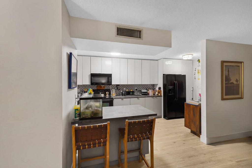 Photo of 5486 COURTYARD Drive #5486, Margate, FL 33063 (MLS # B26084429)