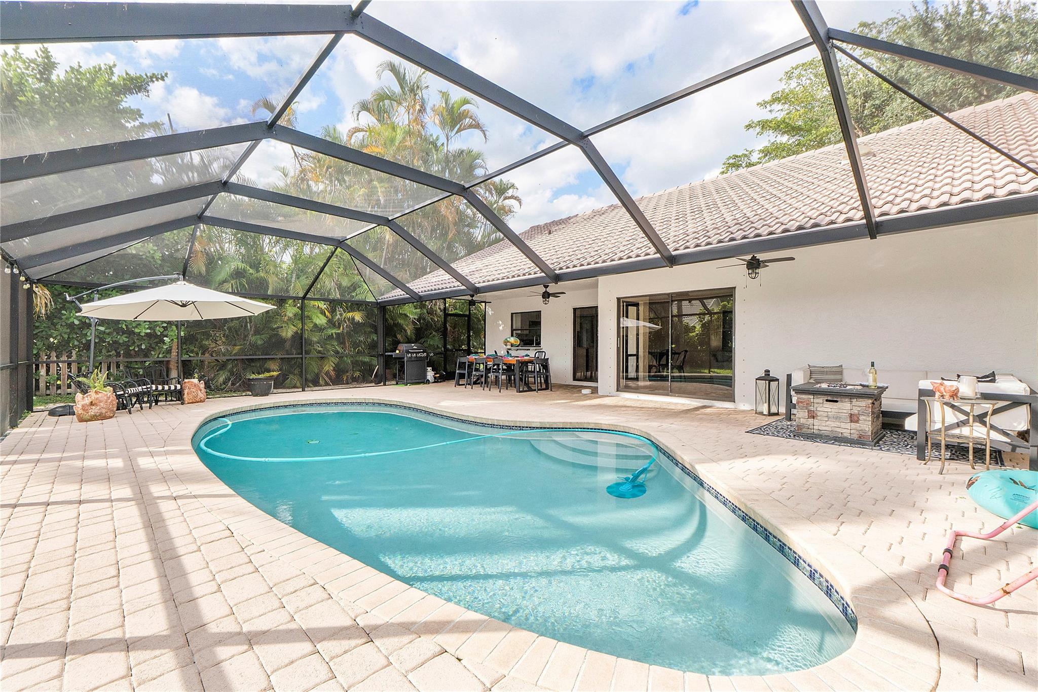Come be amazed when you step into this Beautiful 4BR/2BA pool home with an office, is located in the desirable Pine Ridge community! Open concept with valued ceilings you will feel right at home the moment you walk in.
The primary suite has a walk-in closet and an en-suite bath featuring a double vanity. 3 additional bedrooms plus an office/playroom/flex room provide plenty of space to fit your lifestyle—whether working from home, creating a play space, or setting up a hobby room. At the heart of the home is the kitchen and living area. Step outside to your private backyard oasis, where a heated, screened-in pool awaits. Whether you’re hosting gatherings with family and friends or enjoying a quiet evening under the stars, the backyard is the perfect retreat for relaxation and fun.