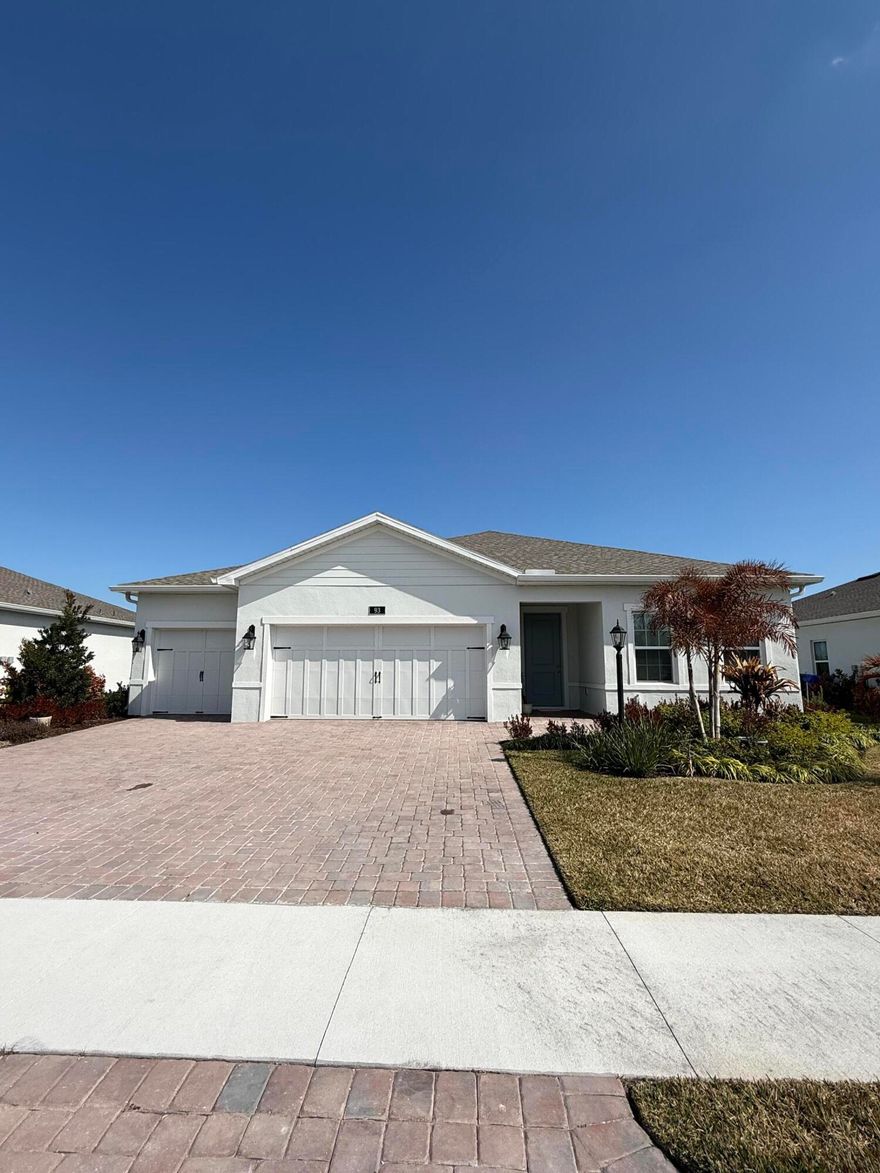 Discover your dream home in the esteemed Agrihood of Spirit of Sebastian, a gated community that embodies the perfect blend of serenity & luxury. This stunning, newly built home boasts 4 bedrooms, 2 full baths, a spacious 3-car garage & a lakefront setting. Notable features: tile flooring throughout, tankless hot water system, gas 5 burner stove, impact glass, full gutters & pendant lighting in kitchen. Community offers trash collection & complimentary weekly vegetables. HOA covers private lawn care & offers access to amenities like a clubhouse, pickleball facilities, & secure gated entry.