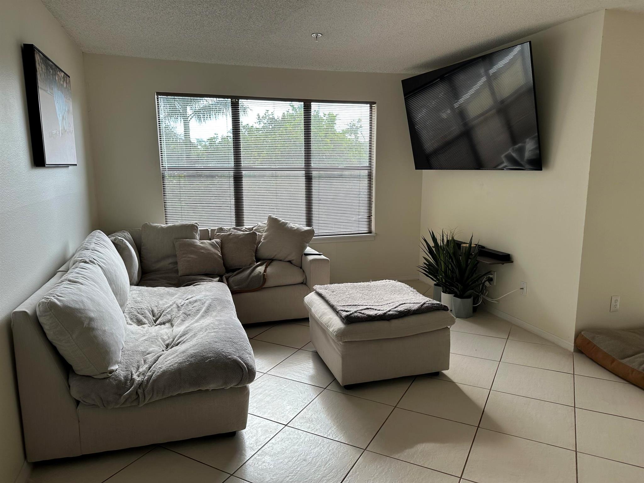 This lovely 1 Bedroom/ 1 Bath with Den (or Sun Room) is in a quiet corner with serene views of nature! This unit boasts new appliances in the updated kitchen, upgraded bathroom and tile flooring throughout. This gated community has everything you could need including a great clubhouse with a renovated pool, renovated tennis/pickleball court, gym, indoor basketball, indoor racquetball. Take a stroll by the lake to relax. Perfect location as it is within walking distance to shops, restaurants, park and a short drive to Palm Beach County's gorgeous beaches.