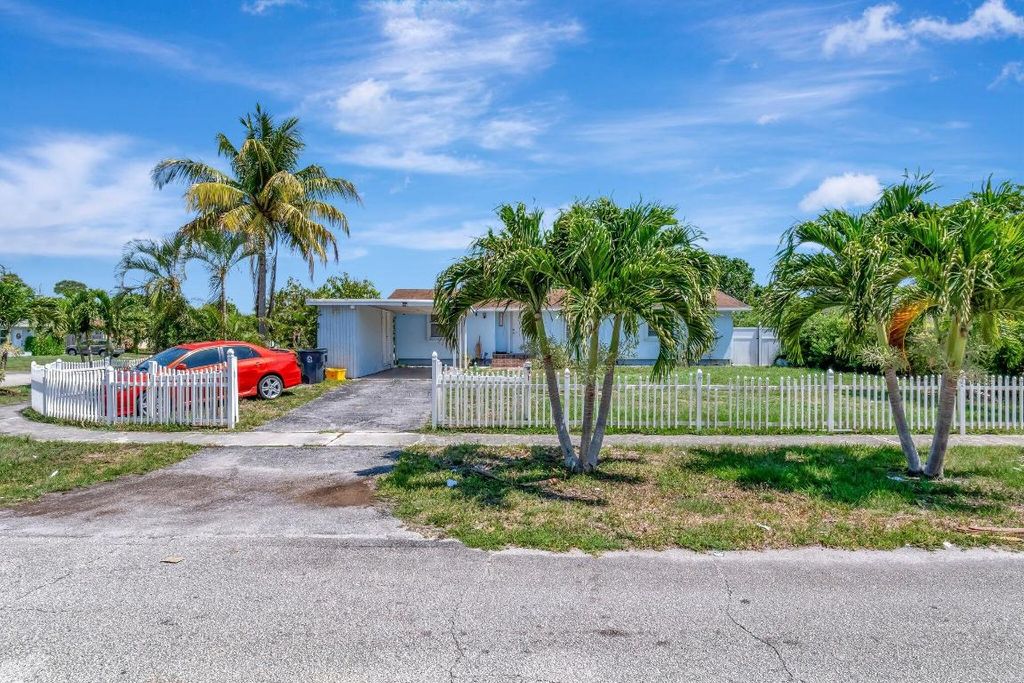 Photo of 3935 Chickasha Road, Atlantis, FL 33462 (MLS # R11091828)