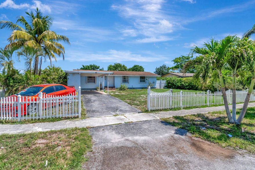 Beautifully maintained 3-bedroom, 2-bathroom residence situated on a spacious fully fenced corner lot in the sought-after community of Atlantis. This home offers a blend of comfort, style, and functionality ideal for families, retirees, or anyone seeking a peaceful South Florida lifestyle.Step inside to discover a bright and open floor plan that effortlessly connects the living, dining, and kitchen areas. The kitchen featuring elegant granite countertops, stainless steel appliances, and ample cabinet space - perfect for everyday cooking and entertaining.The bedrooms are generously sized, offering plenty of natural light and closet space. The primary suite includes a private ensuite bathroom for added convenience and privacy.Roof 2006, AC 2012, Water Heater 2013.