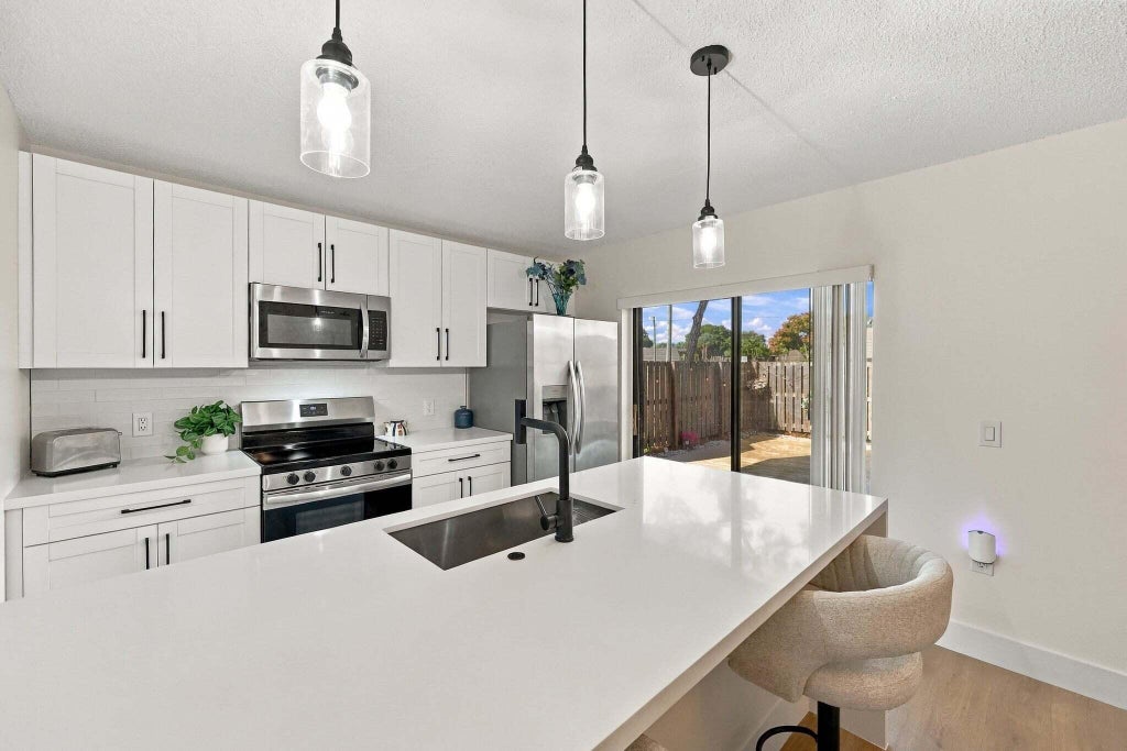 Photo of 120 Heritage Way, West Palm Beach, FL 33407 (MLS # B26093832)