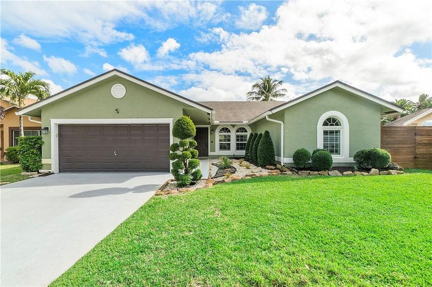 Look no further! Rarely available Beechwood model in Parkwood VI one of the most desirable private neighborhoods of Coconut Creek. This impeccable, very spacious & bright 3/2 with a pool features an open floor plan with cathedral ceilings, new vinyl floor throughout. Updated kitchen & baths. New appliances. Custom walk-in closet in MB. Plantation shutters. Impact windows & doors. Heated pool w new salt system changes color at night. Covered tiled patio and wood deck, perfect for entertaining. Landscaping lighting & beautiful landscape. Parkwood VI is a very friendly Community, perfectly located behind Lyons Creek Middle and the Coconut Creek Rec Center with Gym and Kids new splash park and Playground. Low HOA $40/month. House is in move in condition. Make it home!