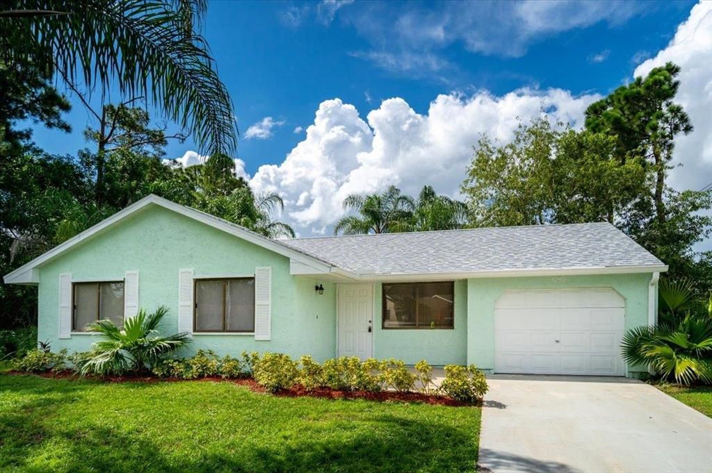 Photo of 1298 SW Fountain Avenue, Port Saint Lucie, FL 34953 (MLS # R10736628)