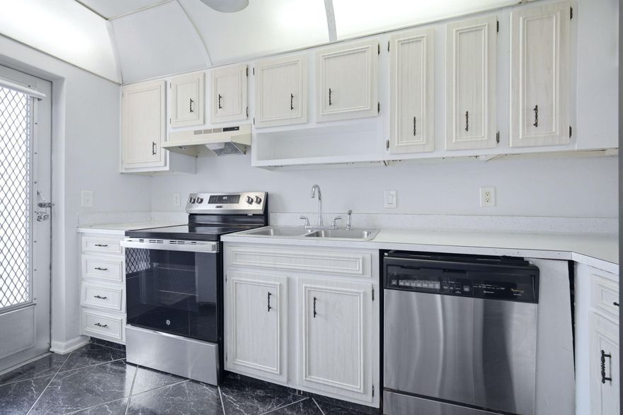 Live the lighthouse point lifestyle in this bright, ground-floor 2/2 condo! All ages welcome. This home features a spacious open layout with striking marble-patterned tile in the kitchen, entry, and patio, paired with carpet in the living and bedroom areas. The kitchen features stainless appliances and a breakfast bar. Relax on your oversized screened patio overlooking peaceful garden views. Highlights: two large walk-in closets, accordion hurricane shutters, and extra storage. Amenities include: heated pool, gym, and clubhouse. Steps from dan Witt park and minutes to the beach. Boat dockage with ocean access available via waiting list! Rentable after 2 years. 640 min credit required. Coastal living at its finest!