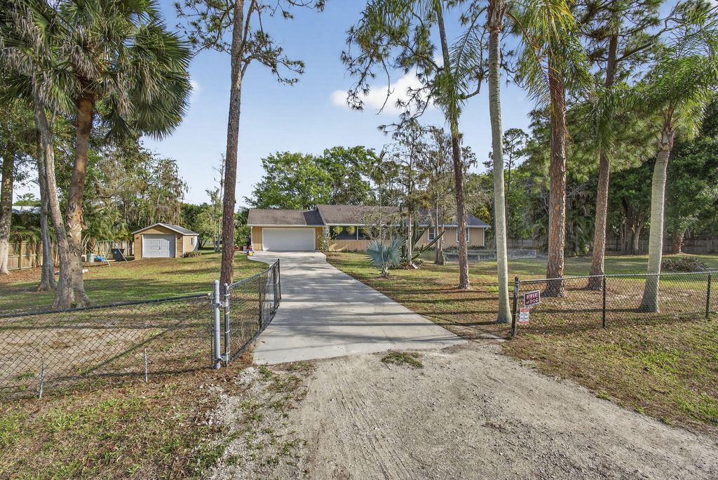 Photo of 16087 E Pleasure Drive, The Acreage, FL 33470 (MLS # B26007168)