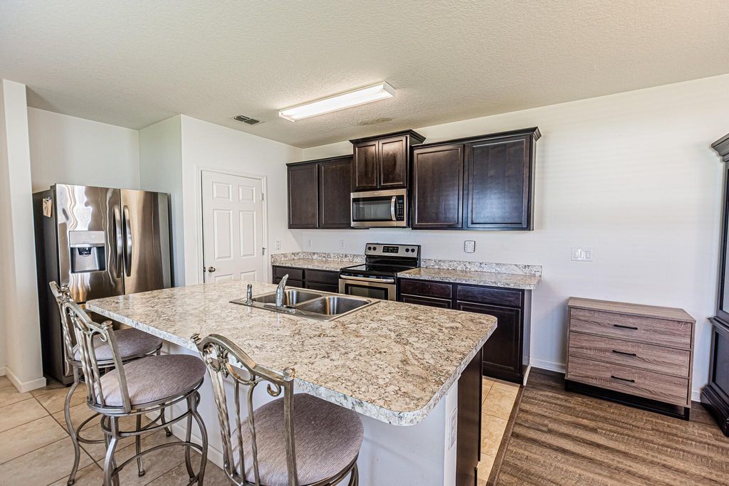 Photo of 10021 SW Newberry Avenue, Port Saint Lucie, FL 34987 (MLS # R10951830)