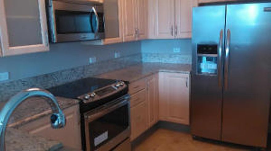 Location! Location! Location! Live in desirable Wilton Station in this luxurious 1 bed 2 full bath condo that has been fully renovated from top to bottom. Tons of upgrades that will make this immediately feel like home. Gorgeous tile floors, full granite kitchen, stainless steel appliances, huge separate whirlpool bathtub, designated parking spot, 24 hour manned guard gates, and separate building security access. PLUS Wilton Station amenities include: Complete 2 story fitness center overlooking the resort style pool, spa and waterfall. Gorgeous movie theater and so much more!  ALL within walking distance to all the great Wilton Manor restaurants, shopping, shows and more.