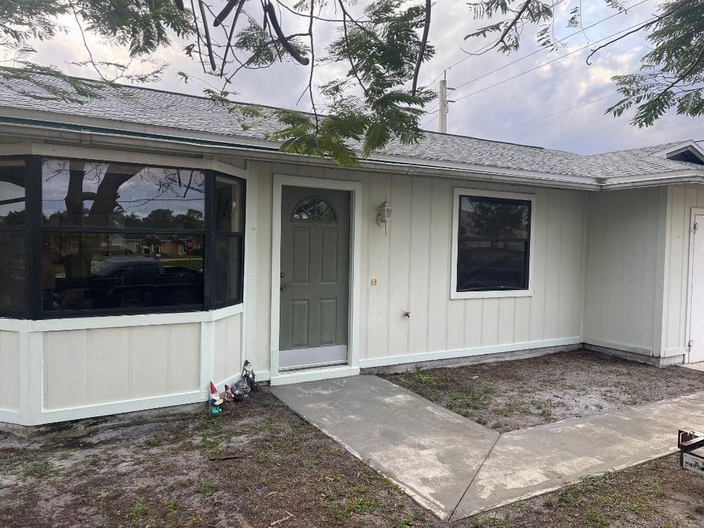 Photo of 3302 SW Frankford Street, Port Saint Lucie, FL 34953 (MLS # R10958096)