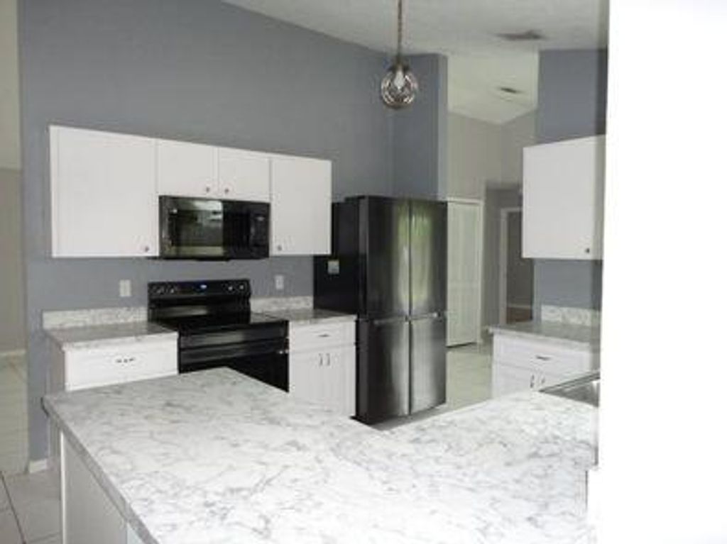 Photo of 3825 SW Koba Street, Port Saint Lucie, FL 34953 (MLS # R10944838)