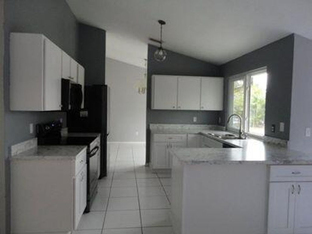 Photo of 3825 SW Koba Street, Port Saint Lucie, FL 34953 (MLS # R10944838)