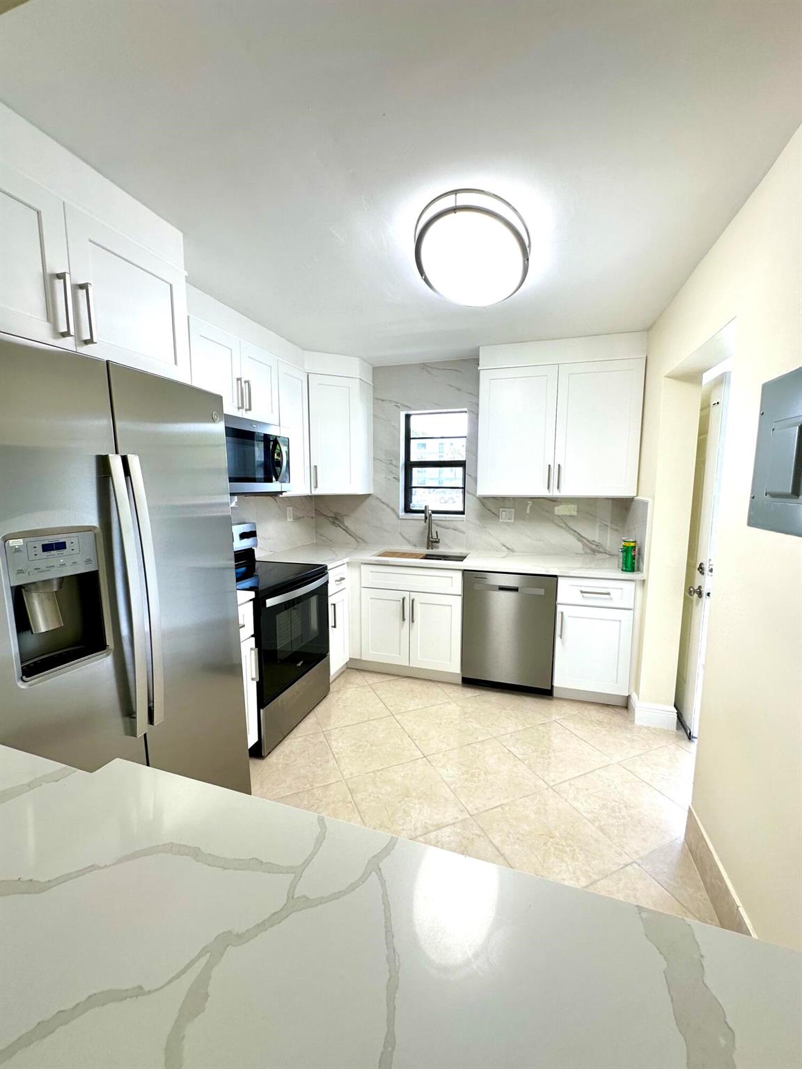 Must See! Beautifully remolded 2 Bedroom 2 BathFirst floor unit with reserved parking directly in front of the unit. Brand New Stainless Steel Kitchen Appliances. Tile Floors throughout. Enclosed Back porch with Washer & Dryer and Garden View. Water & Internet included. Community has Pool & Tennis / Pickle Ball courts.