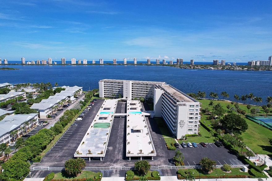 Beautifully updated and fully furnished unit ready to move in! Pride of ownership emanates this unit. Enjoy gorgeous expansive Intracoastal views from every window. This 2/2 features a split floor plan, hurricane shutters, and in-unit washer/dryer! The building offers covered parking, 2 pools (1 heated), putting green, shuffleboard, BBQ, social room with kitchen, library, mailroom, and elevators with a backup generator. Amenities include pickleball, tennis, vita courts, and much more. Just steps to the Marina with boat ramp and just a short drive to Historic Downtown Lake Park!
