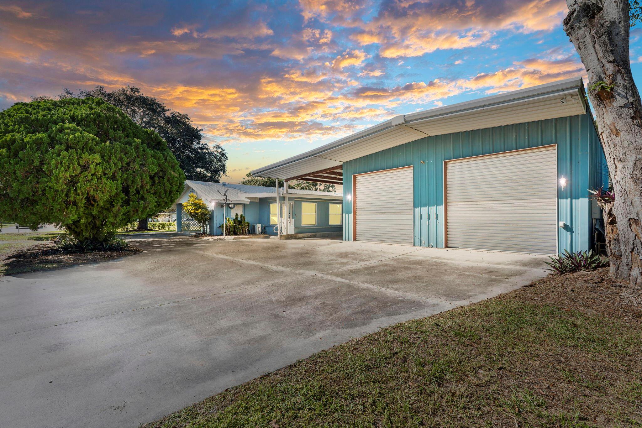 Fully remodeled concrete block home on a corner lot in beautiful Vero Beach! This property features a massive metal warehouse with two automatic bay doors, a full car lift, and room to store up to 10 vehicles. Includes RV covered parking with electric hookup, a covered carport, and a large driveway for plenty of parking. Metal roof for durability. Minutes from the beach, dining, and shopping. Perfect Airbnb or investment opportunity with classic car storage appeal. Furniture negotiable -- if you're a car enthusiast, this is your dream home!