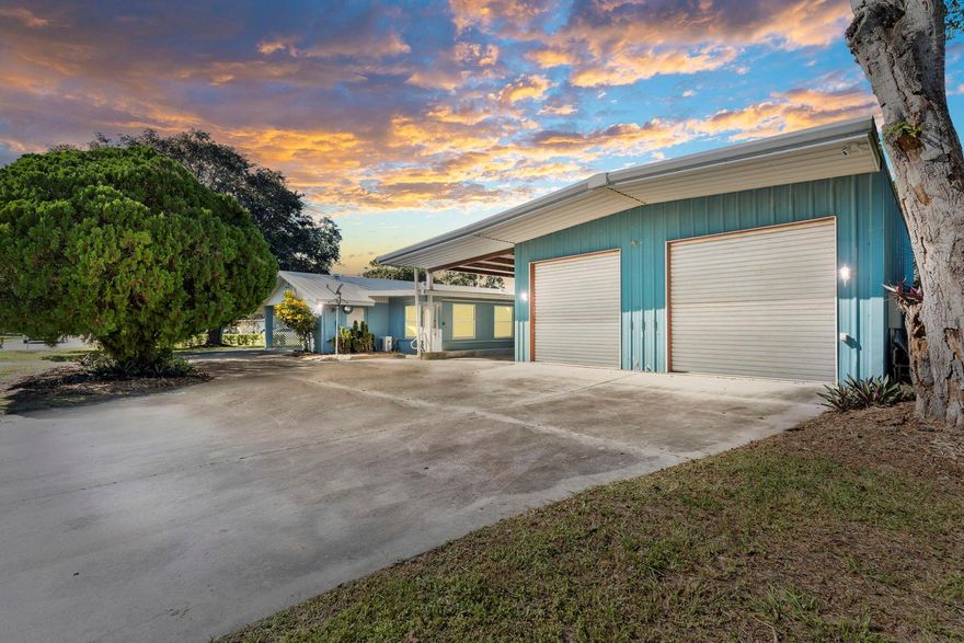 Fully remodeled concrete block home on a corner lot in beautiful Vero Beach! This property features a massive metal warehouse with two automatic bay doors, a full car lift, and room to store up to 10 vehicles. Includes RV covered parking with electric hookup, a covered carport, and a large driveway for plenty of parking. Metal roof for durability. Minutes from the beach, dining, and shopping. Perfect Airbnb or investment opportunity with classic car storage appeal. Furniture negotiable -- if you're a car enthusiast, this is your dream home!