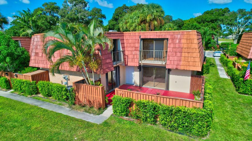 Come and enjoy a beautiful lakefront view from your fully fenced courtyard patio! This 2 bedroom, 2.5 bathroom completely upgraded townhouse has a beautiful, open concept kitchen with newer stainless steel appliances and granite countertops. This bright unit has tile/laminate floors all over, no carpet! Upstairs you will find 2 master bedrooms, primary bedroom has spacious walk in closet and secondary master has large, wall to wall closet. Property features storage area and accordion shutters for peace of mind. Community offers beautiful landscaping with mature trees, tennis courts, pool and basketball courts. Desirable location with easy access to I-95, shopping, restaurants and beach. Don't miss the opportunity to make this your new home!