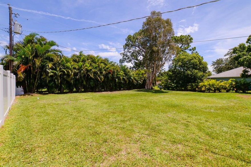 PROFESSIONAL PHOTOS COMING ! WELCOME HOME ! THIS HOME HAS CHARM & COMFORT AS WELL AS A LARGE  FENCED BACKYARD FOR FUN & ENTERTAINMENT. INSIDE FEATURES A DECORATIVE FIREPLACE IN THE LIVING AREA, WITH TILE & LAMINATE FLOORING THRUOUT. A GALLEY STYLE KITCHEN AND COZY DINING AREA ADJACENT TO THE LIVING AREA WITH SLIDERS TO THE BACKYARD. MASTERBEDROOM WITH ENSUITE BATH. GUEST BEDROOM IS LOCATED STEPS FROM THE 2ND BATH. INSIDE LAUNDRY ROOM WITH ACCESS TO THE FINISHED GARAGE. NEWER AC 2025 & NEWER ROOF 2025.  NEWER OUTSIDE PATIO SLAB, NEWER SIDE ACCESS GATE WITH ROOM TO STORE A BOAT.