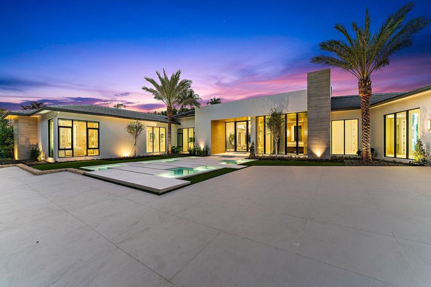 SEE SUPPLEMENTAL REMARKS FOR FULL DETAILS.... Newly constructed this stunning contemporary home offers incomparable luxury as the crème de la crème residence within the renowned Frenchman's Creek Beach & Country Club. Designed by award-winning Bloomfield Construction in conjunction with Affiniti Architects and FULLY FURNISHED & ACCESSORIZED - TURNKEY COMPLETED IN JAN 2023 by designer Terri Polimeni, this palatial residence features 5 bedrooms and 7 full baths and 1 half baths beautifully-executed custom plan with ultra-modern structural angles highlighting massive curb appeal. 
The Residence
Magnificent 16-foot ceilings span the fully-equipped kitchen and cozy living room area. Towering 10-foot doors separate these spaces from the gorgeous owner's suite which sports his & her baths fully stocked his and hers vanity and bathroom that will leave you wanting for nothing, not even a toothbrush, steam showers, and walk-in closets. At 10,279 total square feet the space also encompasses an office, state-of-the-art wine room for 616 bottles, a spacious dining area, homey recreational spaces like the club room outfitted with TVs, a bar, and a pool table with a view into the wine room all of which boast spectacular lake views. In addition, the home comes furnished with 9 flat-screen TVs and second to none Savant automation system. Not to mention the wealth of cutting-edge appliances in the kitchen built with a true entertainer's vision, with not just one, but two massive islands set in the forefront of custom cabinetry, Wolf range top & dual ovens, double dishwashers and Subzero refrigeration including a coffee station with cup warmer, central vacuuming and 3 tankless water heaters. Heating and cooling can be centrally controlled to achieve the perfect temperature throughout while modern and stylish impact windows help to keep the desired atmosphere in and unwanted noise out.
The Outdoors
Find the ultimate entertainment and outdoor living space under a 2,100 sq. ft. covered lanai with automated phantom screening, a summer kitchen, sit down bar and appliances with BBQ and pizza oven. You can also find expertly manicured estate style lush green space to further compliment the modern esthetic,  40x44 infinity-edge pool, a relaxing private spa, spacious conversation areas and a fire table. Come home to a wealth of world-class amenities and pull into your gated circuar driveway w/ upgradeable air conditioned 4 car plus golf cart garage with power for electric vehicle (EV) charging stations, and 11-foot ceilings to accommodate up to 4 additional car lifts.
The Neighborhood
Settle into the premier lifestyle community in South Florida Frenchman's Creek Beach & Country Club. Resort-style amenities and a world-class professional staff make residing in the vicinity an unmatched experience. Whatever your preferences, you can find them here, every day of the year. Residents enjoy unreserved access to a variety of dining venues, recreational facilities, signature events, and social activities with a private beach club and exclusive oceanside amenities in nearby Juno Beach. Enjoy our renowned 36 holes or drive your golf cart to The Bear's Club or Trump National Golf Course Jupiter for more world class golf.
 The coast is calling. Move in and explore this one-of-a-kind lifestyle for yourself.
Square footages and sizes are approximate.