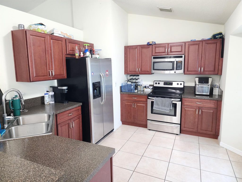 Photo of 842 SE Walters Terrace, Port Saint Lucie, FL 34983 (MLS # R10986131)