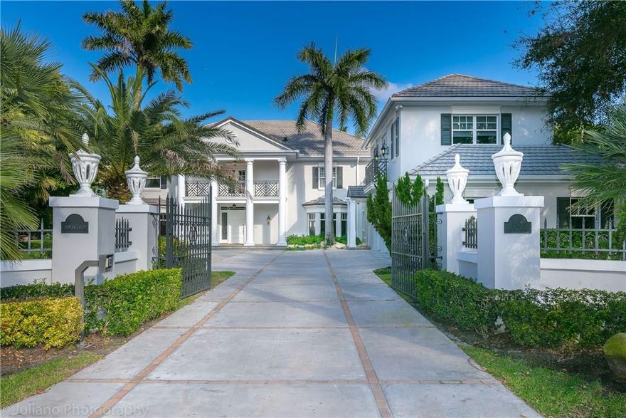 Direct Intracoastal Living in this Gated Estate sited on 136 feet of waterfront. "Ponticello" designed by Famed Architect John Volk transforms Traditional Luxury into Modern Elegance with new updates throughout the entire estate including kitchen, marble floors, gym, lighting and landscaping. Timeless architectural details and contemporary forms lend perfectly to today's design style. This light & airy residence with its tropical grounds provide the perfect setting for both inside & outdoor entertaining.
