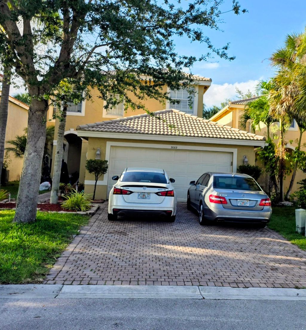 Photo of 5069 Starblaze Drive, Greenacres, FL 33463 (MLS # B26043494)