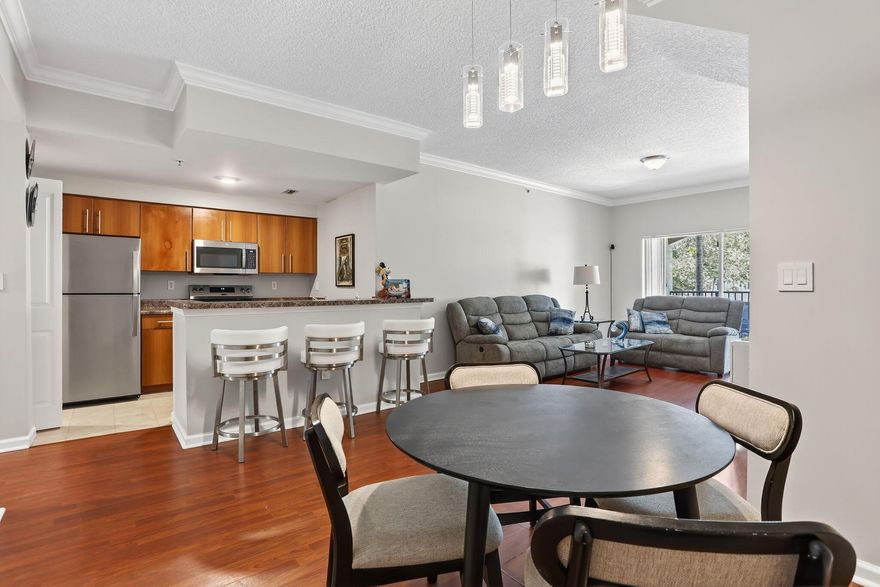 Welcome to your dream 2 Br/2 Ba Townhome Condo in a sought-after gated community of EL-AD Poinciana!  This move-in ready gem boasts a private 1-car garage w/foyer entry leading to a sunlit open floor plan w/separate LR & DR, plus a designer galley kitchen w/ new stainless steel appliances, breakfast bar & Laundry room. Spacious bedrooms offer generous closets, spa-like baths, fresh paint, crown molding, no popcorn ceilings, new roof, new hot water heater & security system. Start mornings on your private balcony w/ serene views. Resort-style amenities include clubhouse, pool, gym & more. Walk to shops, dining and schools. 1 yr wait to rent. 600 credit needed.  Don't miss this rare find- schedule a showing today!  Association has strong reserves!