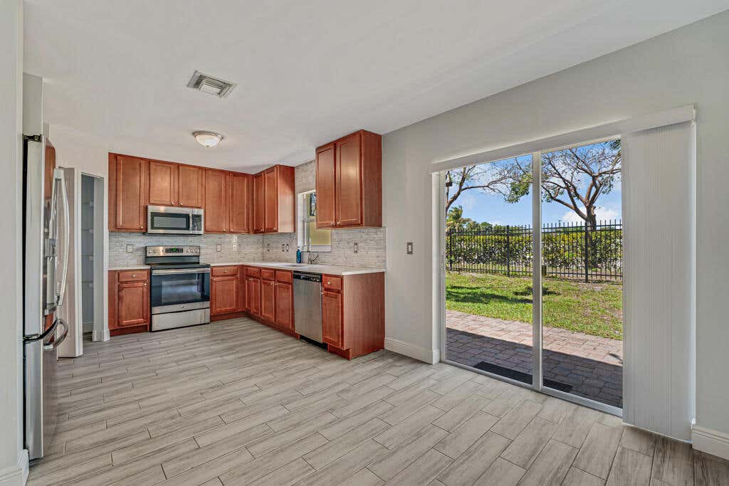 Photo of 813 Imperial Lake Road, West Palm Beach, FL 33413 (MLS # R11081485)