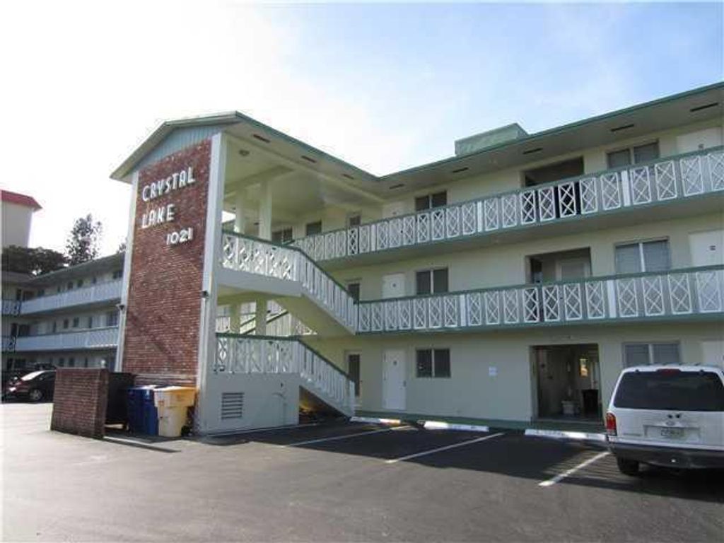 Photo of 1021 Crystal Lake Dr #106, Deerfield Beach, FL 33064 (MLS # R11168743)