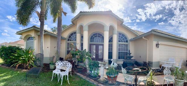 Photo of 1862 SW Altman Avenue, Port Saint Lucie, FL 34953 (MLS # R10771612)