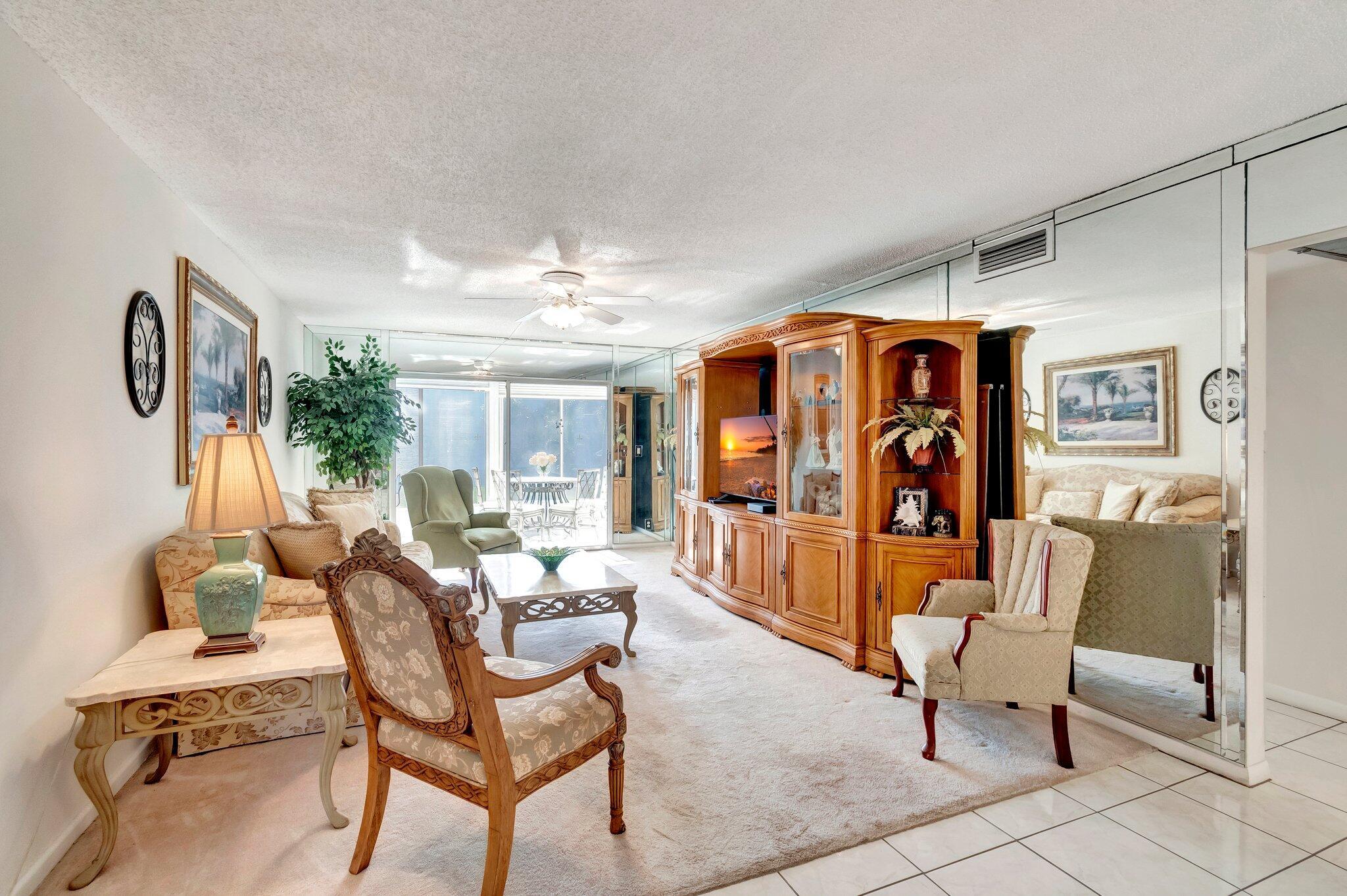 WYNMOOR--ACTIVE ADULT COMMUNITY.Introducing the golden opportunity to acquire the perfectly maintained, second-floor unit located at 2901 Victoria Circle, Unit F2, in the sought-after Coconut Creek, FL 33066 region. This property boasts sophisticated architectural elements and a harmonious integration with the surrounding.Sitting amid an inviting green landscape, the exterior is a pleasing blend of muted neutrals, featuring high-quality construction materials. Grand windows frame the picturesque surroundings, offering breathtaking vistas and sunlit interiors. Each window is a natural masterpiece, presenting a scenic backdrop to this prestigious address.