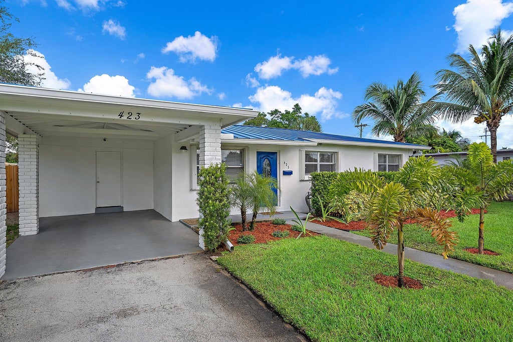 Photo of 423 Hawthorne Drive, Lake Park, FL 33403 (MLS # R11131794)