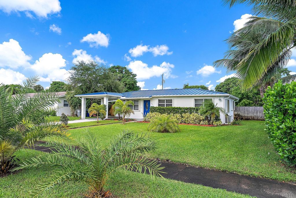 Photo of 423 Hawthorne Drive, Lake Park, FL 33403 (MLS # R11131794)