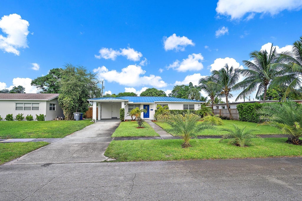Photo of 423 Hawthorne Drive, Lake Park, FL 33403 (MLS # R11131794)