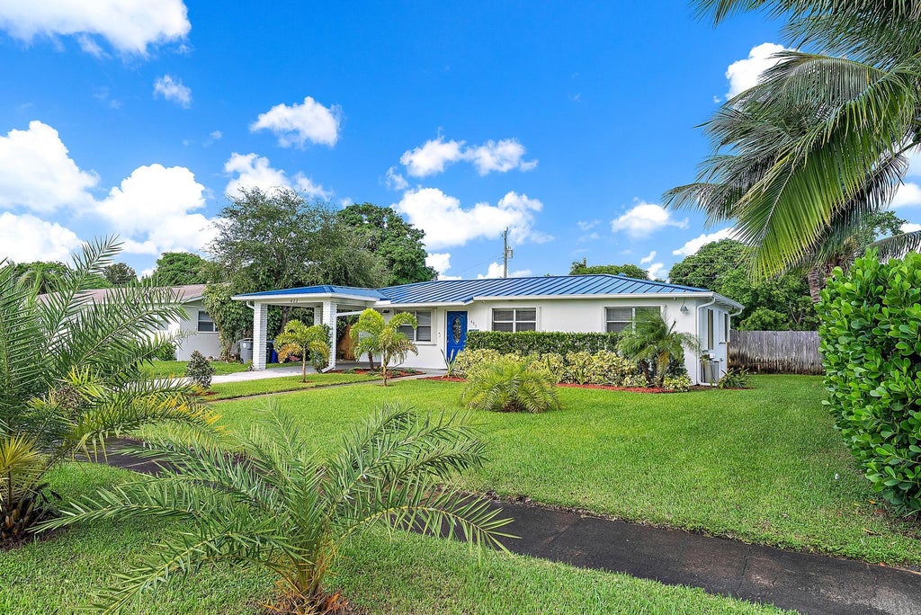 Photo of 423 Hawthorne Drive, Lake Park, FL 33403 (MLS # R11131794)