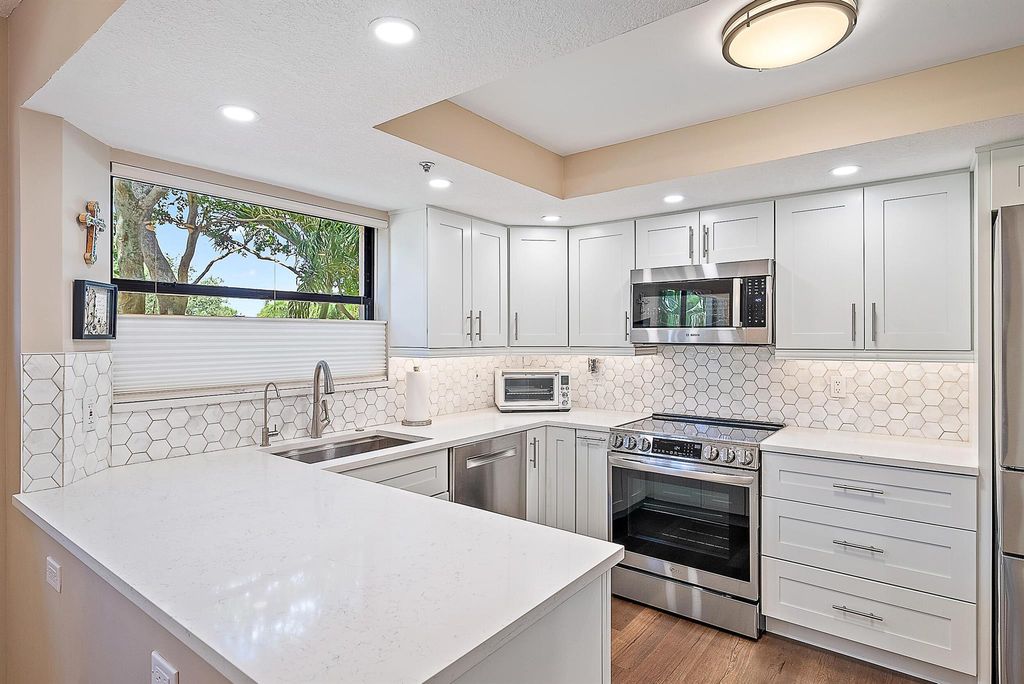 Photo of 700 Uno Lago Drive #201, Juno Beach, FL 33408 (MLS # R11126332)