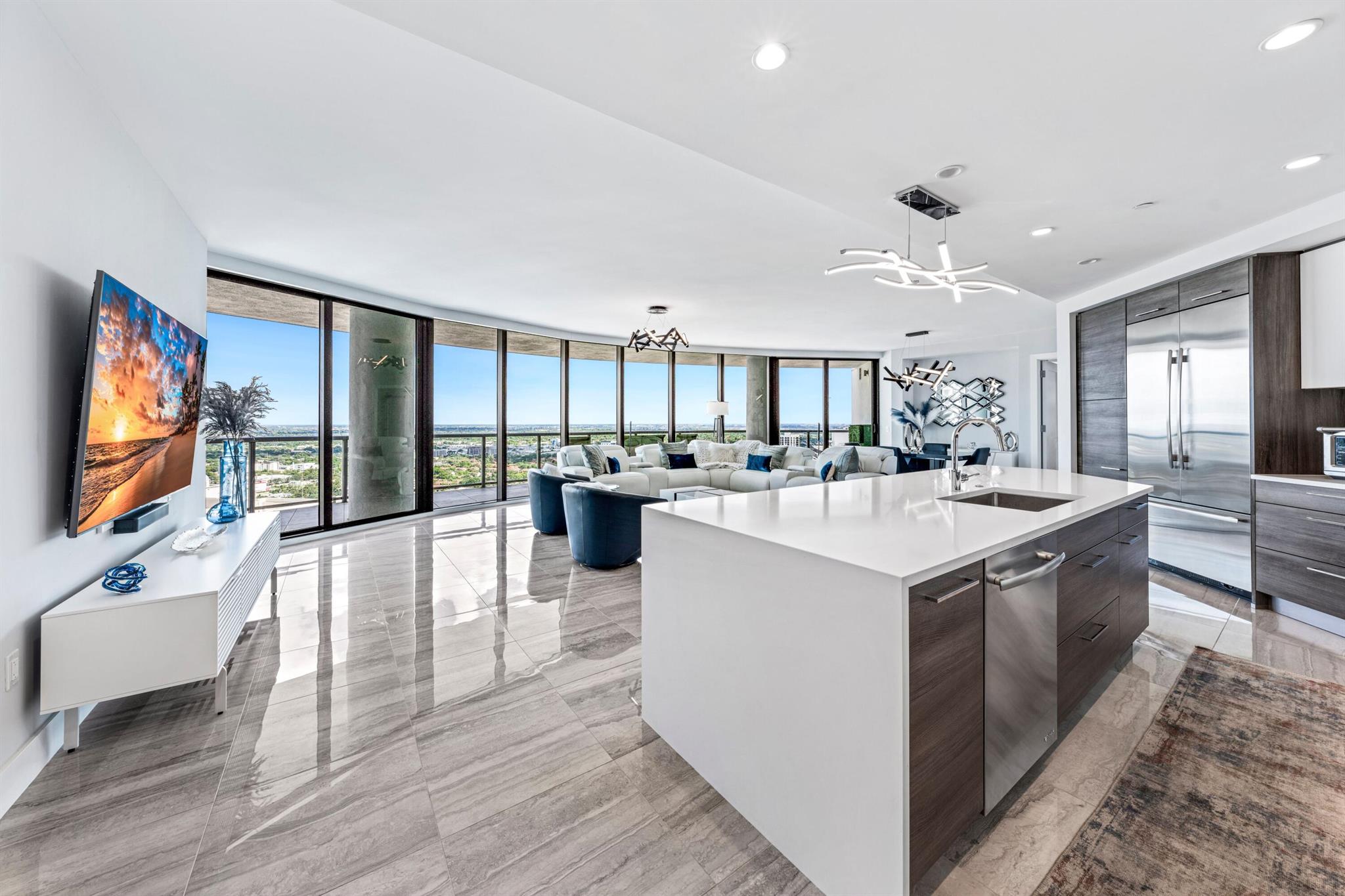 Experience opulent downtown Las Olas living with breathtaking skyline views in this sophisticated modern sanctuary. Spectacular views of the river and the city from this 33rd floor unit at 100 Las Olas The 3 bedroom, 3.5 bathroom condo plus den with French doors for a private theater or office. Stunning wrap-around balcony with mesmerizing sunsets, and spectacular views of the river,.. Boasting luxurious modern decor, and a myriad of upgrades not limited too custom closets, motorized shades, Italian kitchen cabinetry, automatic entry lights in bathrooms and walk-ins, Quartz countertops and porcelain tile flooring. comes with TWO Premium parking spots that are side-by-side, right by the entry door. You can self park or valet, your choice. Towering 46 stories high