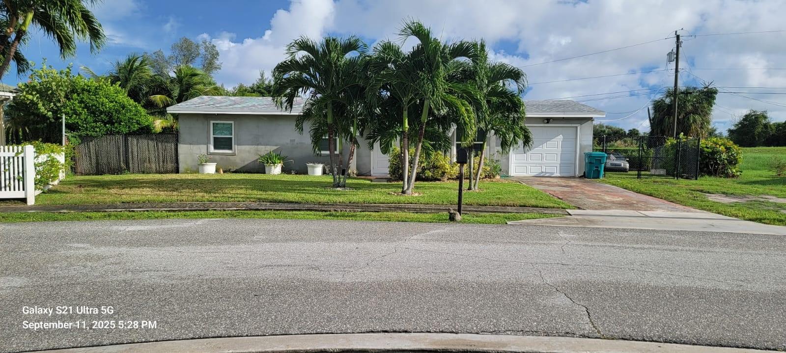 Massive lot with ample parking for boats, RVs, and Landscape equipment. Entertainer's dream backyard features a sparkling pool for endless fun and barbecues. Plenty of room for everyone and their toys and pets. Enjoy hassle-free living with included professional weekly pool maintenance included.