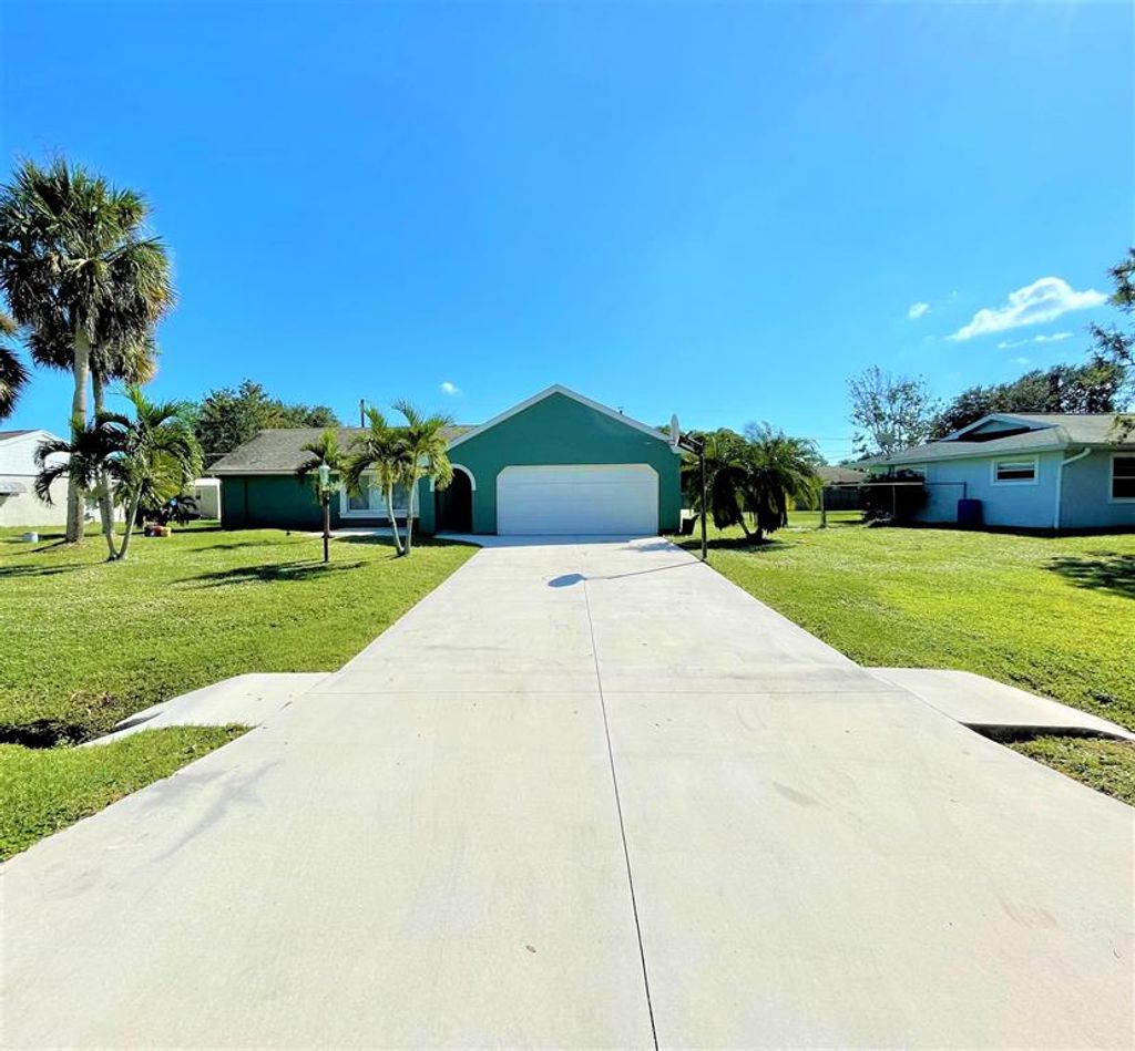Photo of 2115 SE Holland Street, Port Saint Lucie, FL 34952 (MLS # R10749478)