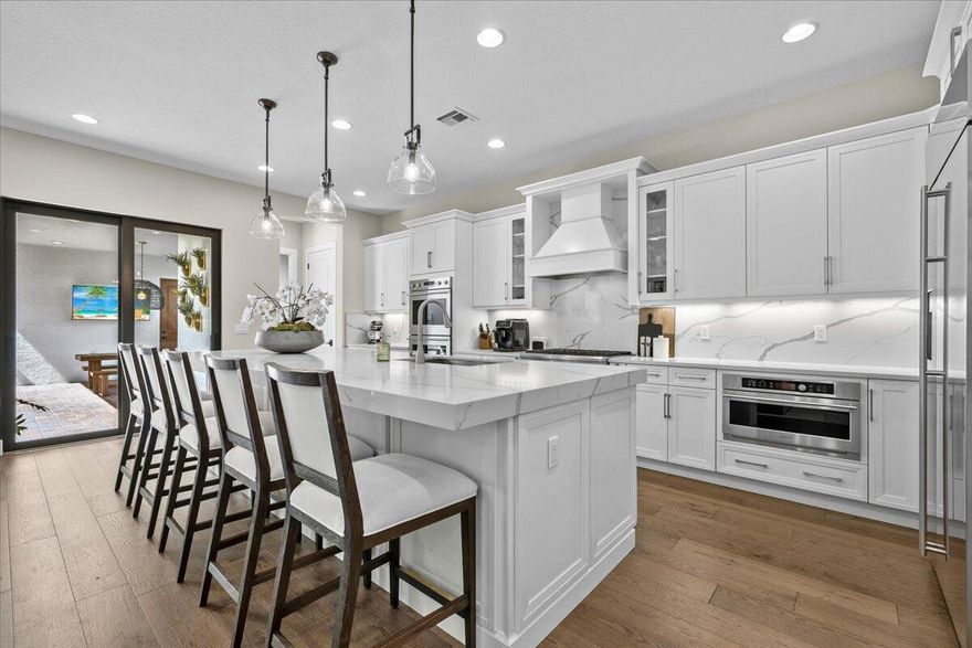 Impressively finished Park E/ Manchester model in prime Alton location. Porch swings on the covered patio greet visitors before they step inside to be welcomed by real wood floors and restoration hardware lighting fixtures. The highly upgraded kitchen features a built in refrigerator, wood vent hood and upgraded counters and cabinetry, including a built-in pantry and cabinet wrapped island. The owners suite has two large built in closets, a free standing tub and a private balcony. All 3 guest rooms feature a walk in closet and each bathroom and even the laundry room have been thoughtfully upgraded. Recently upgraded a/c systems and a new tankless hot water heater make this newer construction home a turnkey experience. Only a couple of doors down from The Club at Alton recreation center.