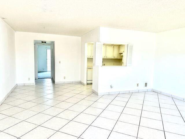Enjoy resort-style living in this apartment located in Century Village 2nd. floor condo: Building offers spacious elevator for comfortable access to second floor. Community allows pets with emotional support (please check Community Requirement). Spacious kitchen features countertops and oversized passthrough, new carpet in the bedroom, bright terrace offers space for seating and enjoy the view. The Community offers many world class amenities: 125,000 SqFt Clubhouse with wifi, 1252 seat theater, Fitness Center, Billiards, Card Rooms, 17 outdoor swimming pools, 1 indoor swimming pool, 8 tennis courts, 4 pickleball courts, 4 combo tennis/pickleball, Bocce Court, shuffleboard and much more.........