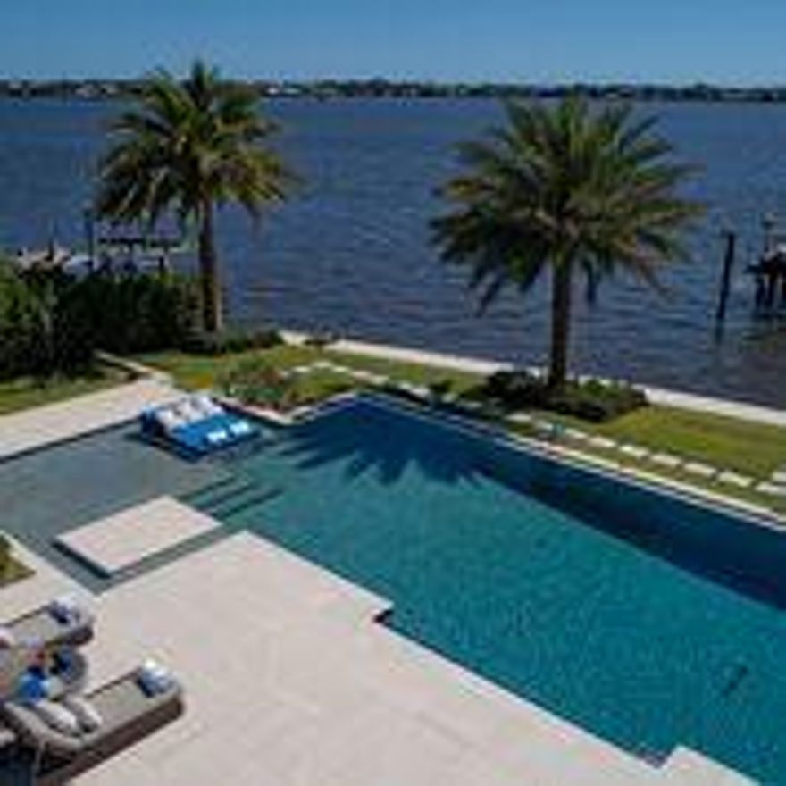 3200 boasts the best views in WPB on the widest section of water with close access to the inlet and a 100'' dock  with 2 lifts. This modern home has every detail included and is a fully automated Crestron Smart home. The home is 10 minutes from PBI and you can be on the Island in less than two minutes. This is the best deep water location on the water in WPB looking at the island mansions. The house is like a resort that you never have to leave with multiple destinations to entertain and eat inside and out. The house is virtually hurricane proof with a 100kw generator. Additionally the home has a salon, a separate waterfront gymnasium and outdoor kitchen with pizza oven. The movie theater is three levels and there is a game room and two full offices. The furniture is available for sale.
