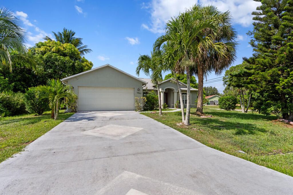 Photo of 1042 SW Janette Avenue, Port Saint Lucie, FL 34953 (MLS # R11101894)