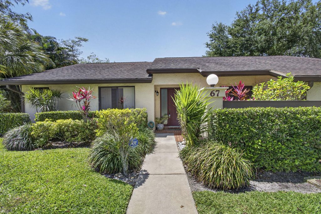 Photo of 67 Macadamia Court, Royal Palm Beach, FL 33411 (MLS # B26019023)